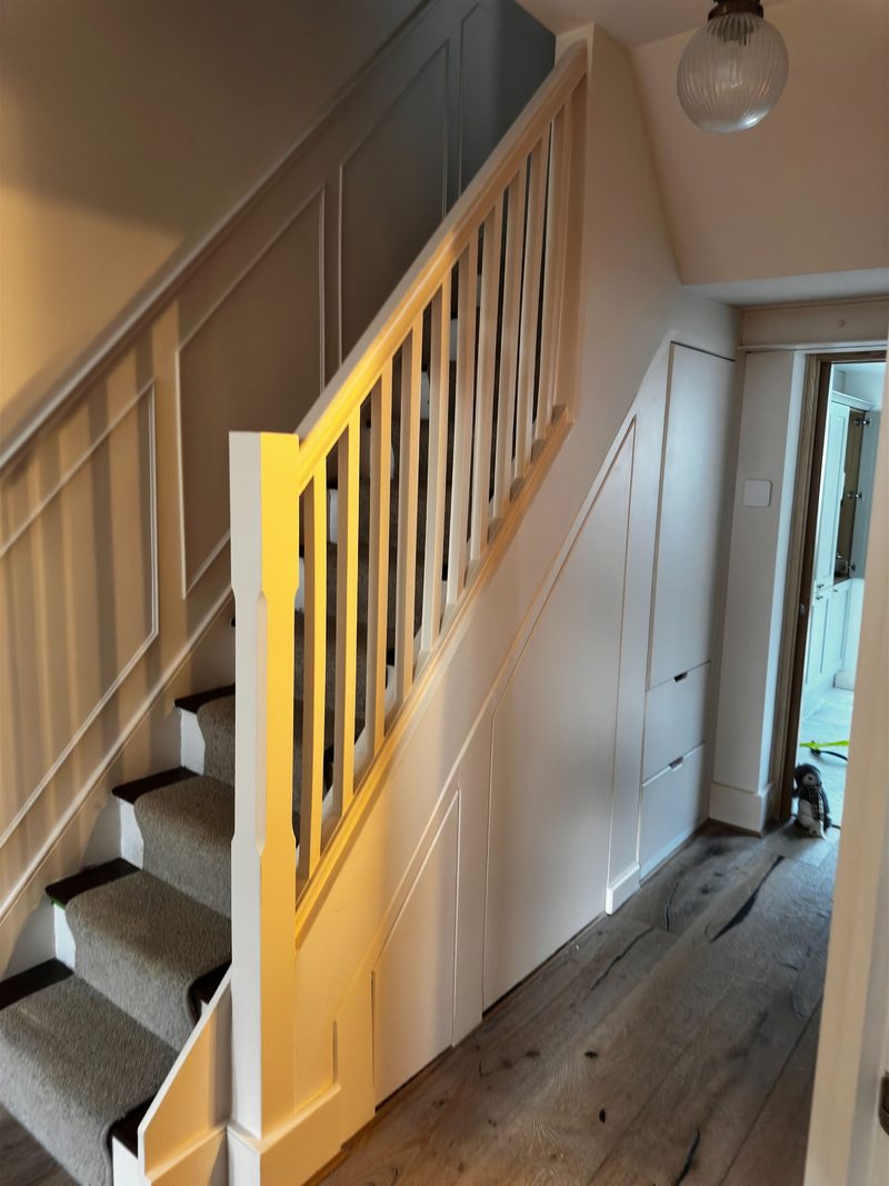 Painted staircase, balustrade and panelled wainscoting in a Victorian London home